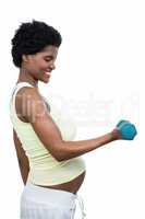 Pregnant woman lifting dumbbell