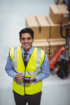 Warehouse worker using hand scanner