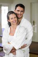 Couple in bathrobe embracing each other