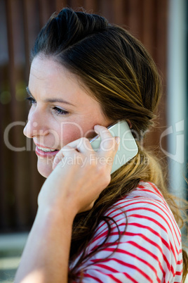 smiling woman speaking on her phone