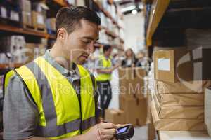 Warehouse worker scanning box