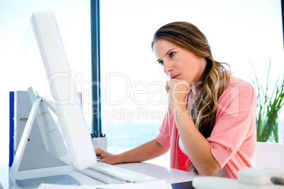 concerned businessWoman staring worriedly at a computer