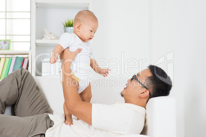 Father playing with baby boy