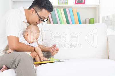 Father and child reading story book