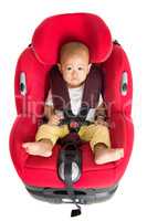 Baby boy sitting in car seat isolated