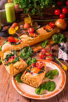 farmer baguette filled with egg, bacon and spinach