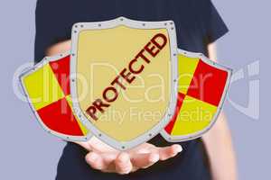 Hand holding protective shield with sign