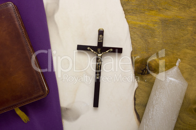 Catholic cross with a crucifix on manuscripts