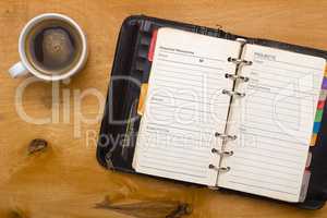 Open diary on wooden table