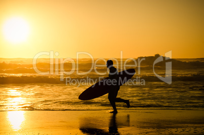 Surfer running