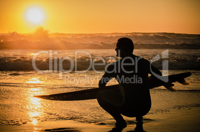 Surfer watching the waves