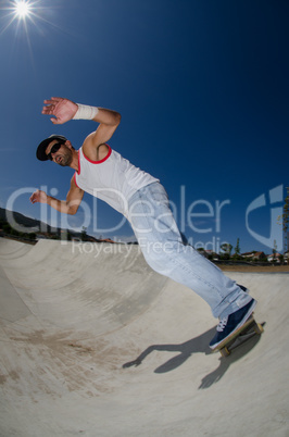 Skateboarder in a concrete pool