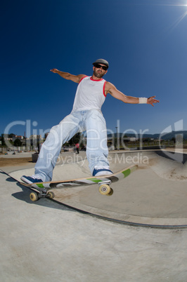 Skateboarder in a concrete pool