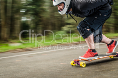 Downhill skateboarder in action