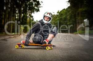 Downhill skateboarder in action