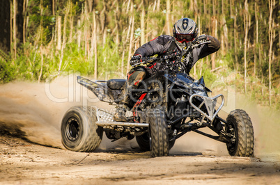 ATV racer takes a turn during a race.