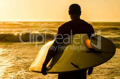 Surfer watching the waves