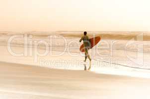 Surfer running