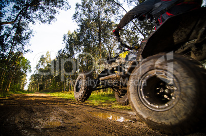 Quad rider jumping