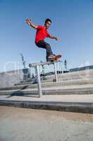 Skateboarder on rail