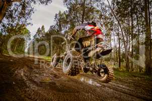 Quad rider jumping
