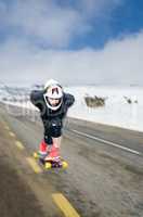 Downhill skateboarder in action