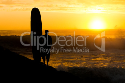 Long boarder watching the waves