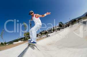 Skateboarder in a concrete pool