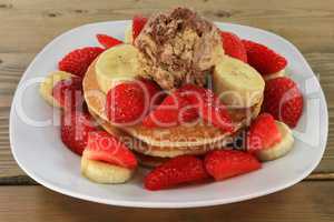 Pancakes Strawberries Banana Maple syrup Ice cream