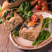 farmer baguette filled with egg, bacon and spinach