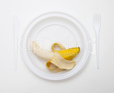 White disposable dishware set Fork, Knife, Peanut and Banana