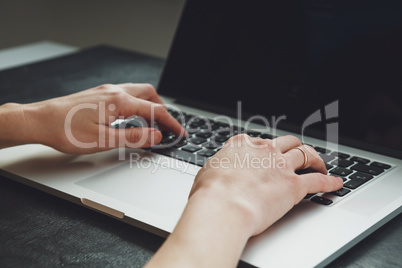 woman's hands working on laptop computer