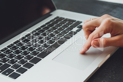 woman's hands working on laptop computer