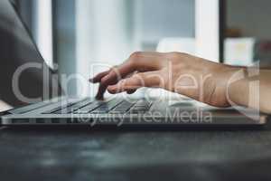 woman's hands working on laptop computer