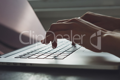 woman's hands working on laptop computer
