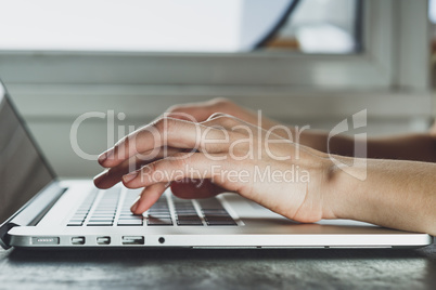 woman's hands working on laptop computer