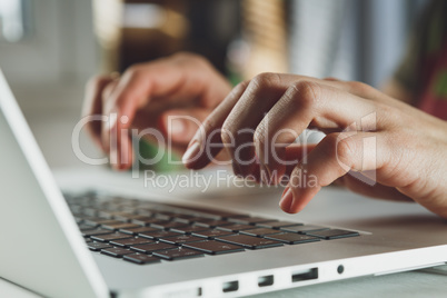 woman's hands working on laptop computer