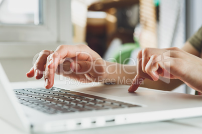 woman's hands working on laptop computer