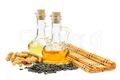 sunflower seeds, peanuts and oil isolated on white background