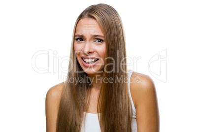 Portrait of frowned woman on white background
