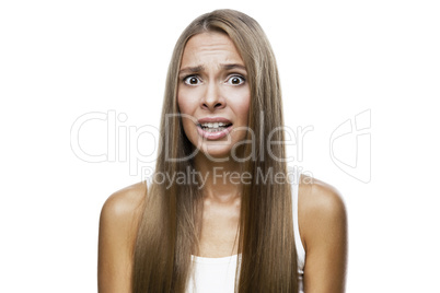 Portrait of frowned woman on white background