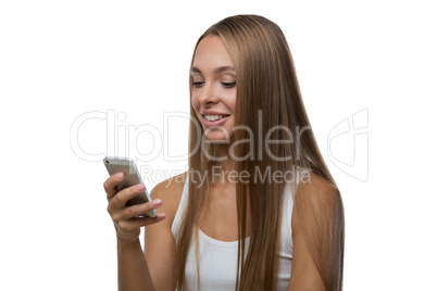 Woman looks at the smartphone screen and smiles