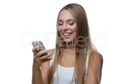 Woman looks at the smartphone screen and smiles