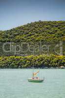 Small sail boat on lake Abrau