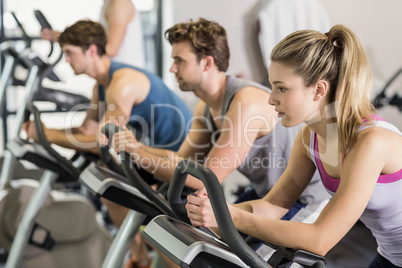 Fit people doing exercise bike