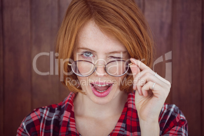 beautiful hipster woman winking at the camera