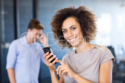 Colleagues communicating on mobile phone