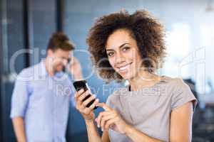 Colleagues communicating on mobile phone