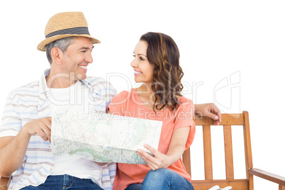 Couple on bench looking at map