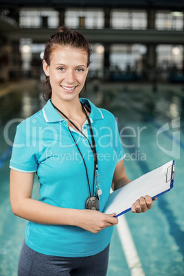 Trainer woman holding a clipboard